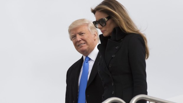US President-elect Donald Trump and wife Melania arrive in Washington, the day before the inauguration.