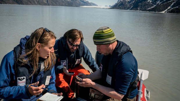 Scientists prepare to collect sediment samples a few miles up the Sermilik Fjord.
