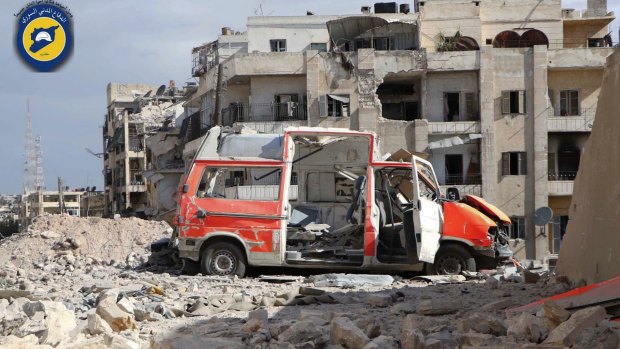 A destroyed ambulance is seen outside the Syrian Civil Defence main centre after airstrikes in eastern Aleppo.