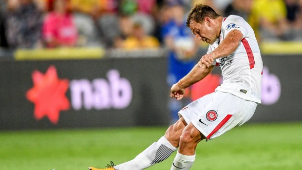 Drought-breaker: Brendon Santalab scores for the Wanderers against the Mariners.