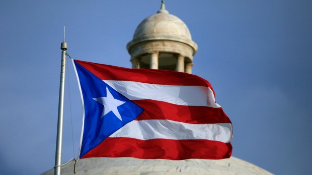 The Puerto Rican flag flies in front of Puerto Rico's Capitol as in San Juan, Puerto Rico. 