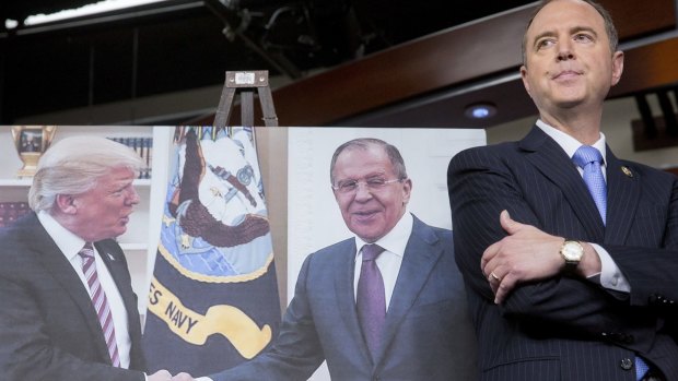 Representative Adam Schiff, a Democrat stands next to a photograph of US Donald Trump and Russian Foreign Minister Sergei Lavrov during a news conference on Capitol Hill.