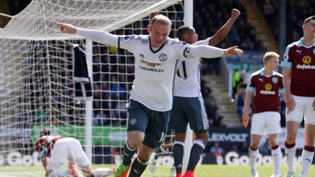 Wayne Rooney celebrates Manchester United's second goal. 