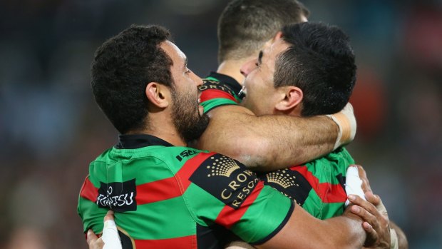 Just too good: Dylan Walker,Greg Inglis and Bryson Goodwin of the Rabbitohs celebrate after one of many South Sydney tries.