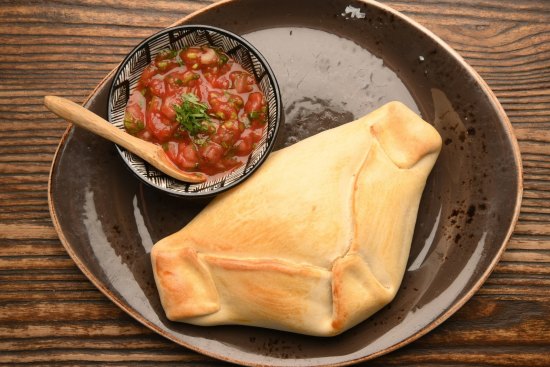 Empanada De Pino filled with beef mince, onion, olives and boiled egg.