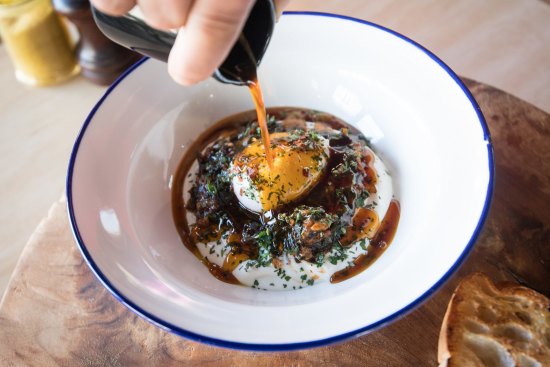 Cilbir - poached egg, yoghurt and wilted spinach with spiced burnt butter poured at the table.