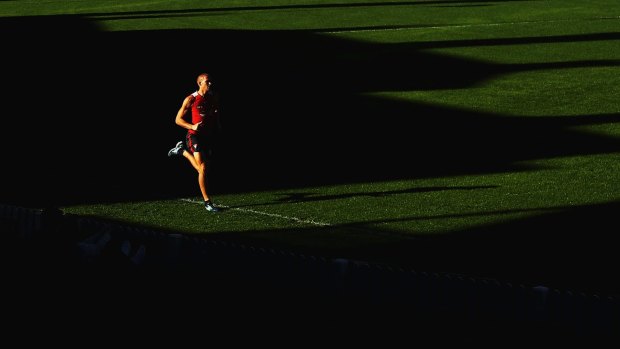 On the run: Sydney's Sam Reid training at Sydney Cricket Ground.
