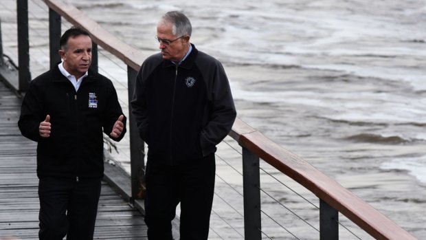 Liberal MP for Bass Andrew Nikolic and Prime Minister Malcolm Turnbull viewing the flooded Tamar River last week. 