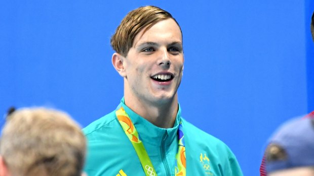 Kyle Chalmers with his gold medal for the men's 100m freestyle.