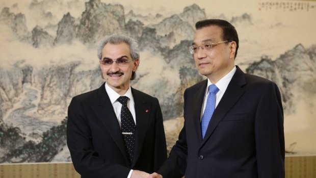 Saudi Prince Alwaleed bin Tala shakes hands with China's Premier Li Keqiang at Zhongnanhai, in Beijing, in  May last year. 