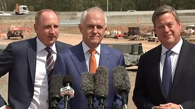 Queensland MP Luke Howarth - pictured with Prime Minister Malcolm Turnbull and Queensland Opposition Leader Tim Nicholls - has said he is sorry for dropping the f-bomb during the press conference.