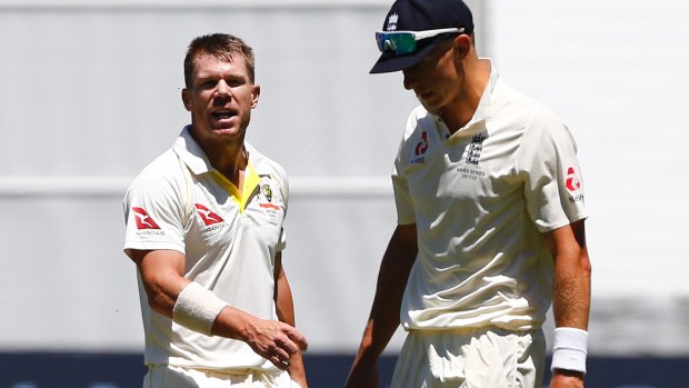 Biting back: David Warner chirps away at English seamer Tom Curran.