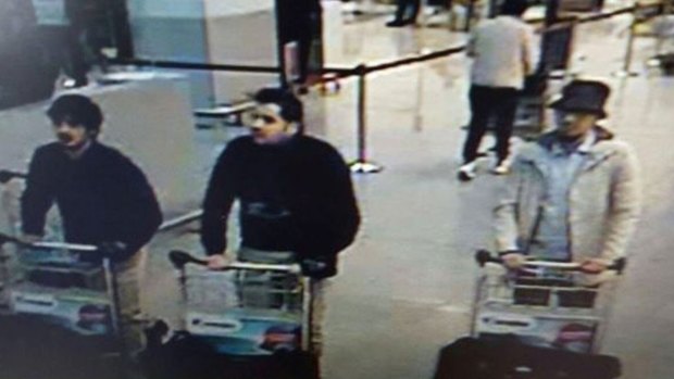 The man in the centre is Ibrahim el-Bakraoui, who blew himself up at Brussels Airport.  His brother Khalid set off a bomb on a train. The man on the right wearing a hat fled and is being hunted by police.