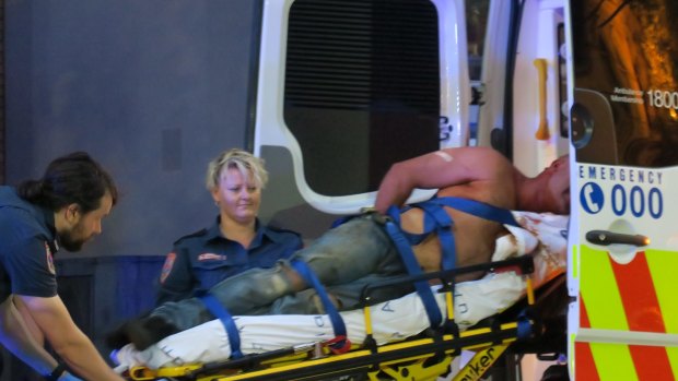 A man is taken to hospital after allegedly fighting with police during the Moomba festival.