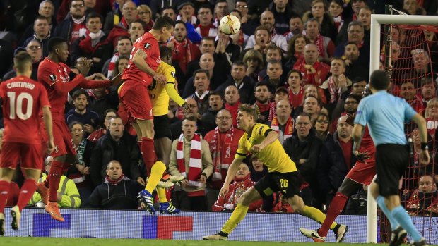 Leaving it late: Dejan Lovren headed in the final goal in Liverpool's thrilling 4-3 win over Borussia Dortmund.