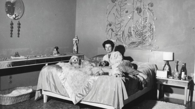 Peggy Guggenheim in her bedroom at Palazzo Venier dei Leoni in the early 1950s.