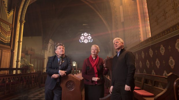 Conservation architect Arthur Andronas (right) with former councillor Serge Thomann and parishioner Valerie Lion inside St Kilda's crumbling Christ Church. 