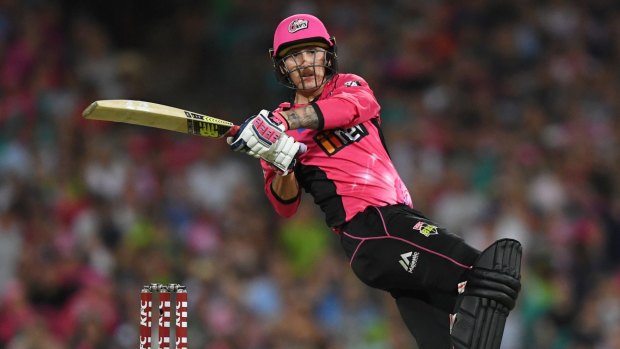Nic Maddinson hits a six for the Sydney Sixers in their Big Bash derby with Sydney Thunder at the SCG on Saturday night.