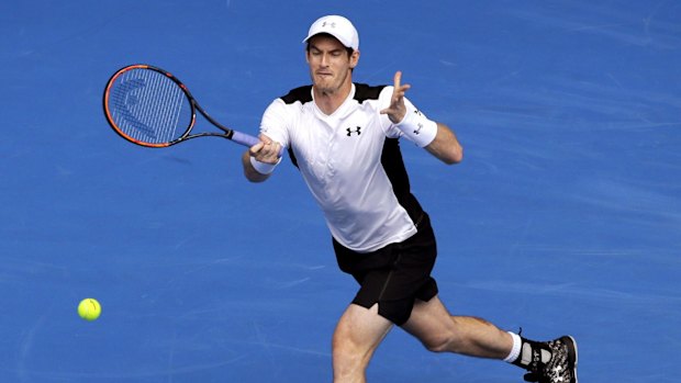 Andy Murray hits a forehand return.