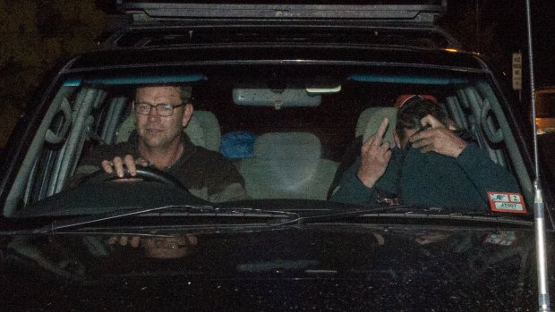 Mark Tromp leaves the Wangaratta Police Station (right) at night after being found.