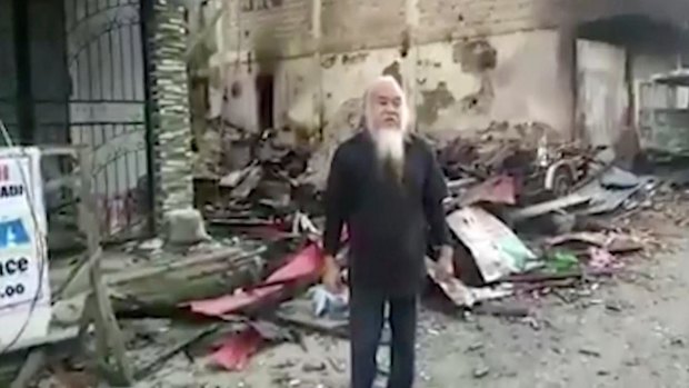 This image made from undated militant video appears to show Father Teresito Suganob, held hostage by Islamists in Marawi.