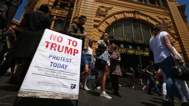 Protesters gather at Flinders Street Station. 