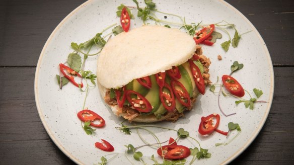 White corn arepa filled with pulled chicken, sour cream, avocado and chilli. 