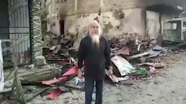 This image made from undated militant video appears to show Father Teresito Suganob, held hostage by Islamists in Marawi.