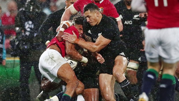 Red Card: Anthony Watson of the Lions is hit with a high tackle by Sonny Bill Williams of the All Blacks.