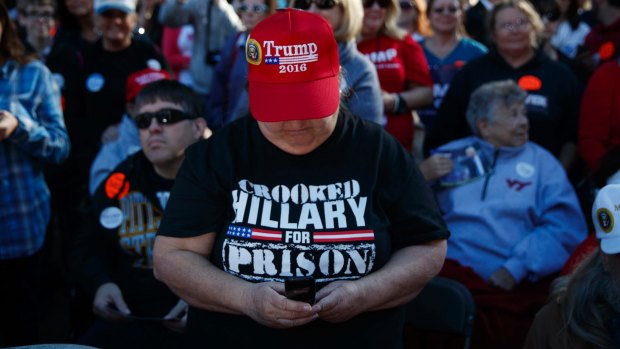 A Trump supporter wears a 'Crooked Hillary for prison' T-shirt  at a rally at Regent University, Virginia Beach.