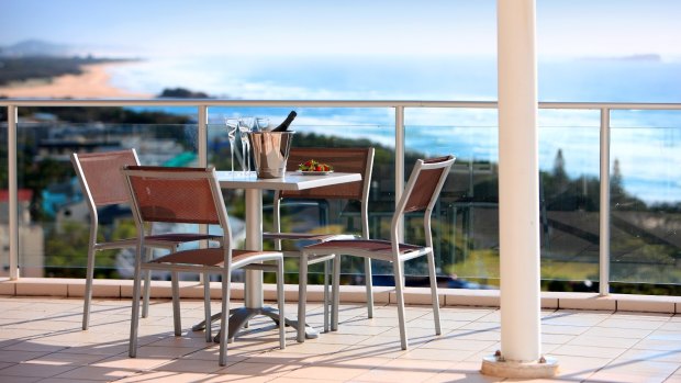 The wide balconies are perfect for relaxing and dining.