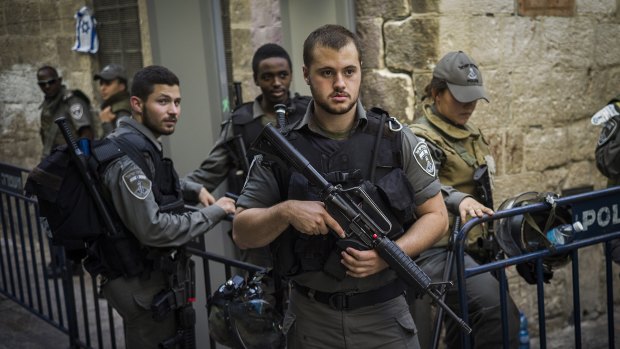 Rising tensions: Police and security stand guard in Jerusalem last week.