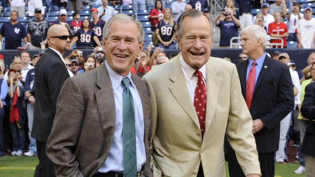 George W. Bush with his father, George H.W. Bush in 2009. 