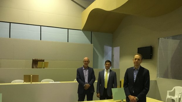 From left, architect Cameron Lyon, Juris Partnership general manager David Lovell, and Attorney-General Simon Corbell who toured the mock courtroom on Tuesday.