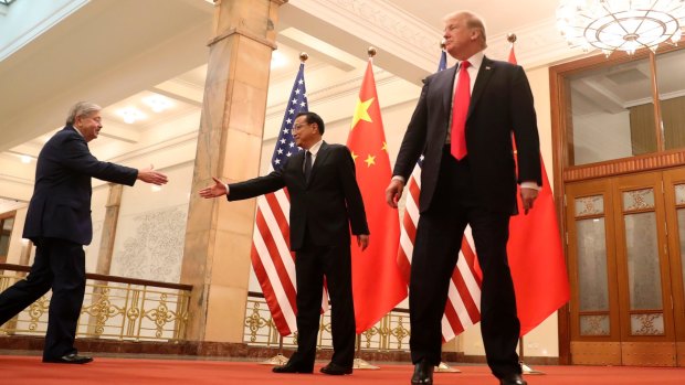 US President Donald Trump and US Ambassador to China Terry Branstad.