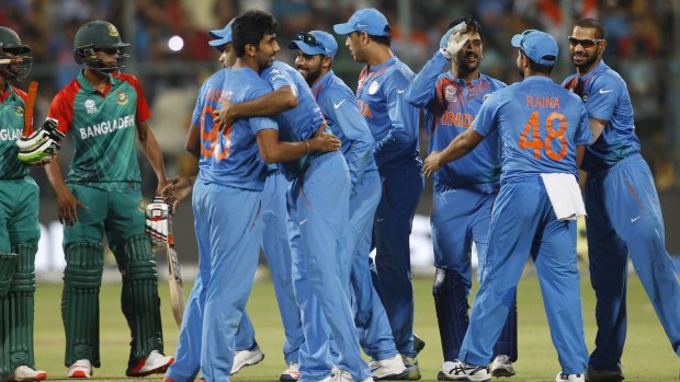 One for the books: Indian players celebrate their remarkable win against Bangladesh.