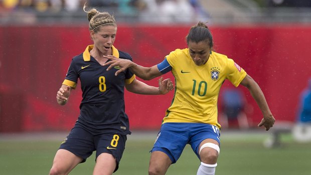 In fine form: Australia's Elise Kellond-Knight battles Brazilian legend Marta during the Matildas' 1-0 win.