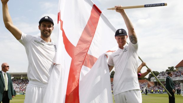 England's Mark Wood and Ben Stokes celebrate after winning the Ashes.