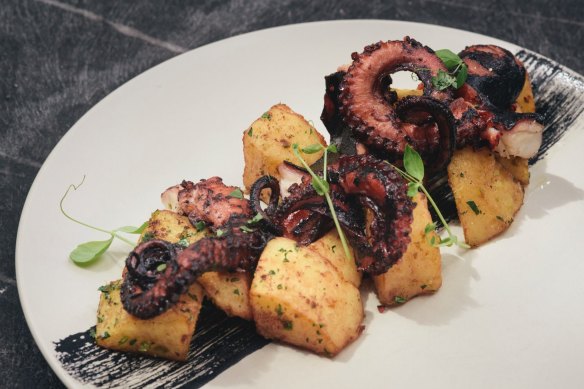 Char-grilled octopus, lemon potatoes and a swipe of squid ink.