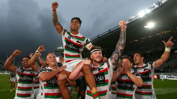 Redfern hero: Rabbitohs players hold captain Issac Luke on their shoulders as they celebrate winning the Auckland Nines.