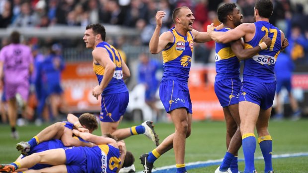 Eagles players including Dom Sheed (third from right) react after winning the 2018 AFL Grand Final between the West Coast Eagles and the Collingwood Magpies at the MCG in Melbourne, Saturday, September 29, 2018. (AAP Image/Julian Smith) NO ARCHIVING, EDITORIAL USE ONLY