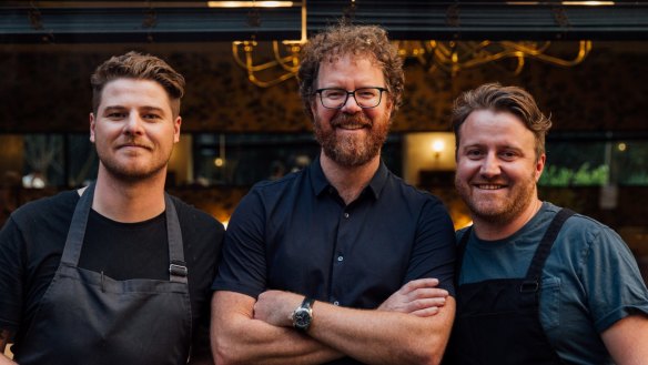 Staying put: Pope Joan head chef Jake McWilliams, far left, with David Mackintosh and Matt Wilkinson at the now-permanent site.