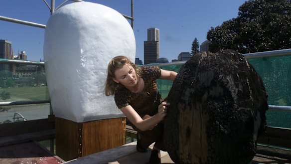 Cummins repairs damage to the Brett Whitely matchstick sculpture outside the Art Gallery of NSW in 2002.