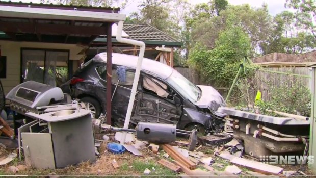 A car smashed through the porch of a home at Ipswich.