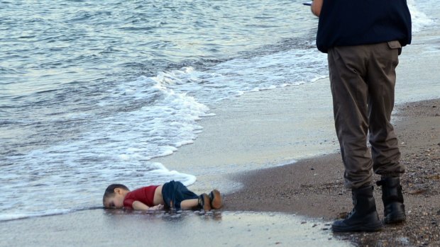 The lifeless body of Aylan Kurdi lies on a Turkish beach.