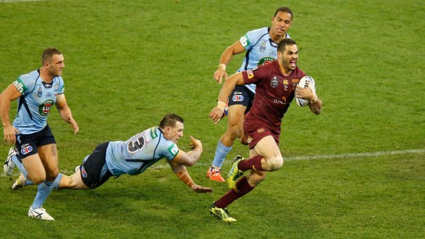 Greg Inglis outstrips the Blues defence to score for Queensland.