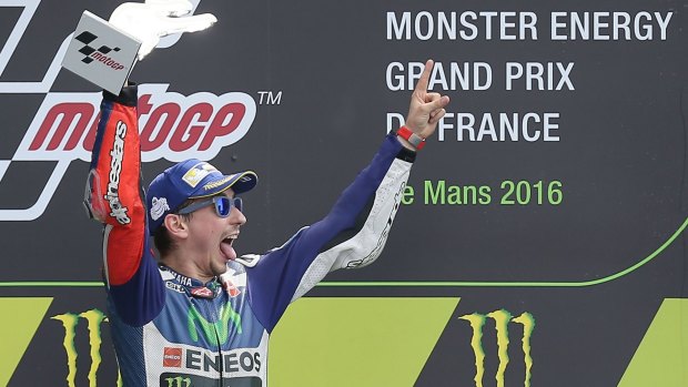 Yamaha's Jorge Lorenzo celebrates on the podium.