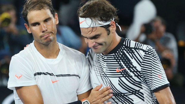 Great players, great men: Rafael Nadal congratulates Roger Federer on his Australian Open triumph. 