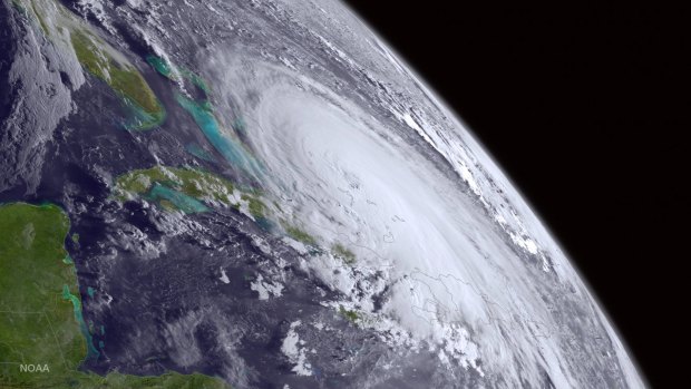 Hurricane Joaquin pounded lightly populated islands of the eastern Bahamas on Thursday, and forecasters said it could grow more intense while following a path off the US east coast by the weekend.