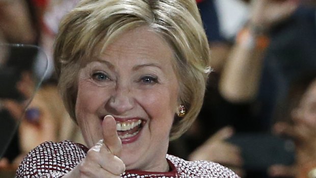 Democratic presidential candidate Hillary Clinton celebrates on stage after winning the New York state primary election.